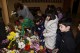 Обкичиха с цветя барелефа на  Петко Славейков